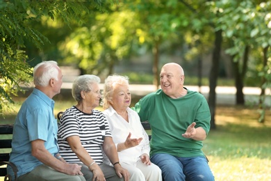 Photo of Elderly people spending time together in park