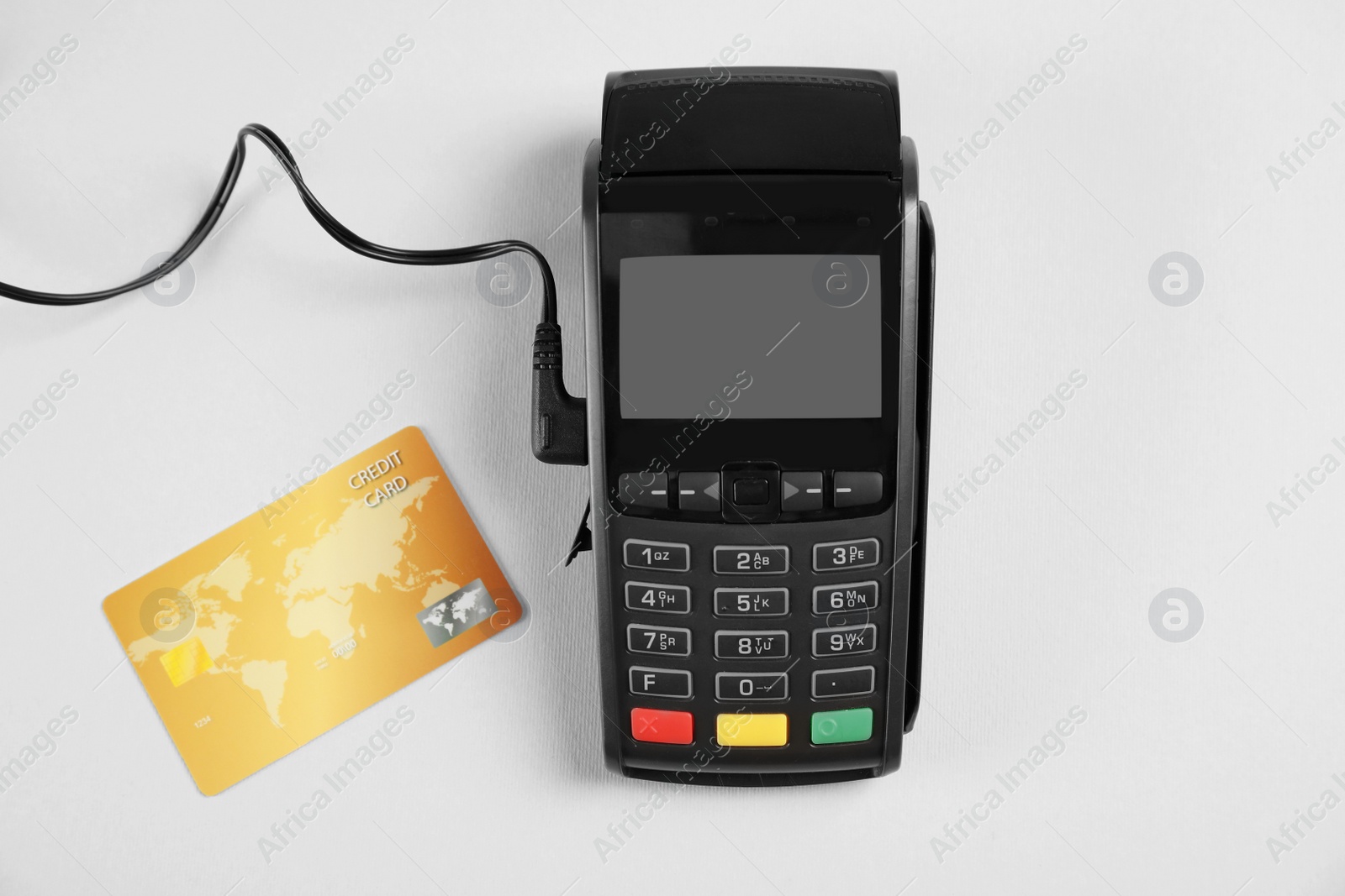 Photo of Modern payment terminal and credit card on grey background, top view