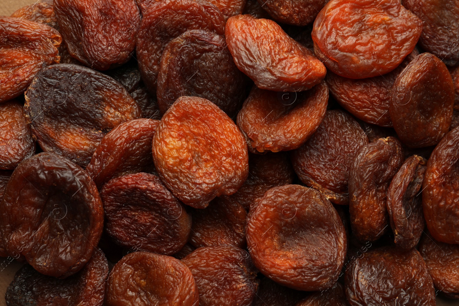 Photo of Tasty dried apricots as background, top view. Healthy snack