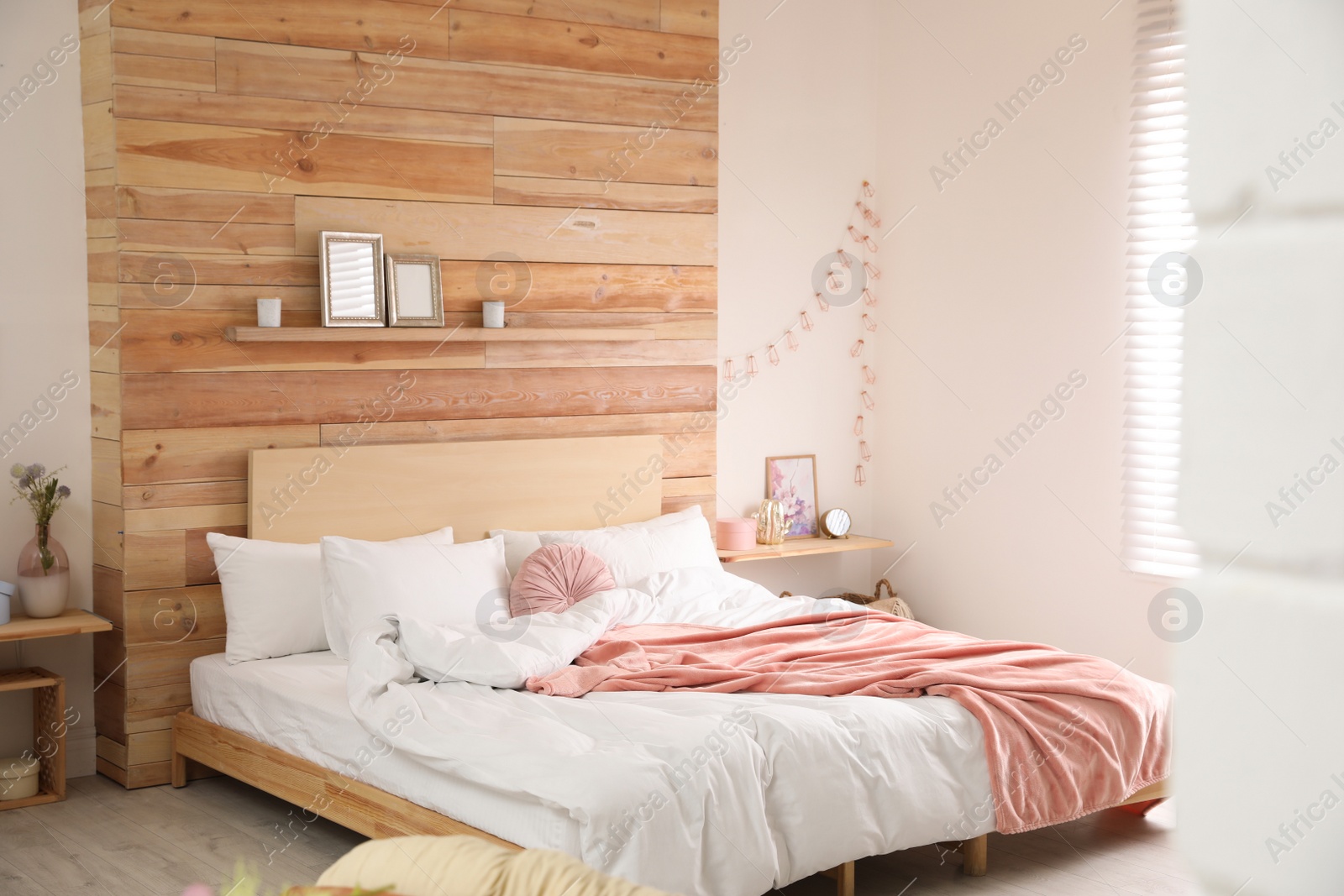 Photo of Stylish room interior with big comfortable bed