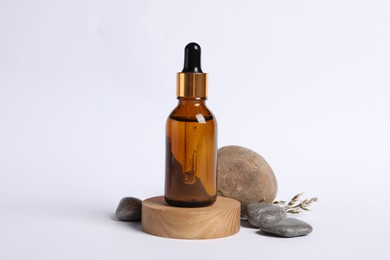 Photo of Composition with bottle of cosmetic serum on white background