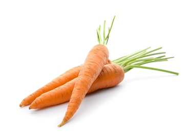 Ripe fresh carrots on white background