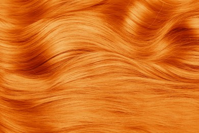Image of Beautiful orange hair as background, top view