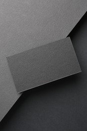 Photo of Blank business card on black background, top view. Mockup for design