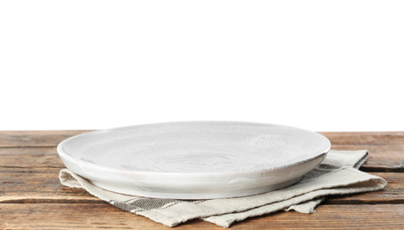 Photo of Empty plate and napkin on wooden table against white background