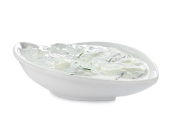 Photo of Gravy boat with cucumber sauce on white background