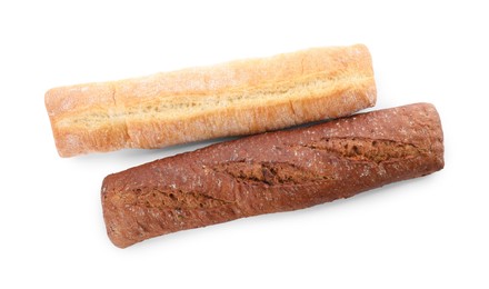 Photo of Different tasty baguettes on white background, top view. Fresh bread