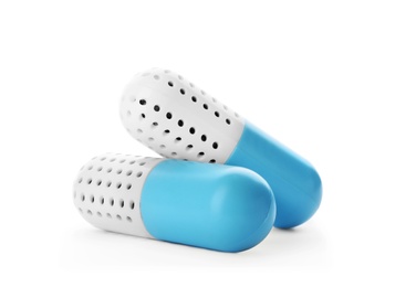 Photo of Capsule shoe fresheners on white background