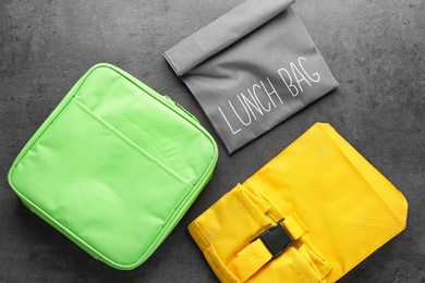 Photo of Lunch bags on gray background, top view