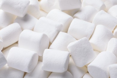 Photo of Delicious white puffy marshmallows as background, closeup