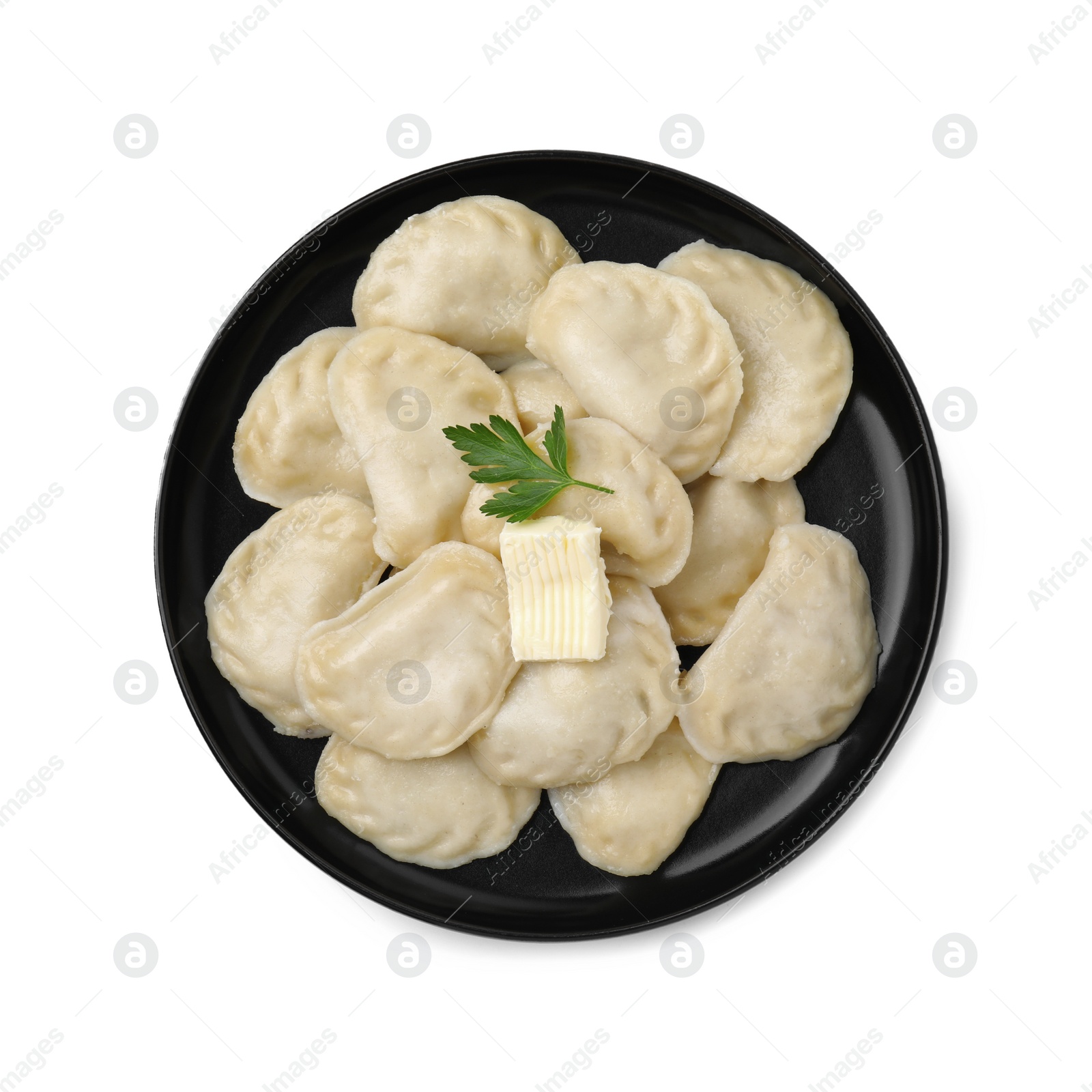 Photo of Delicious dumplings (varenyky) with tasty filling, butter and parsley isolated on white, top view