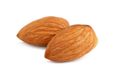 Photo of Organic almond nuts on white background, closeup. Healthy snack