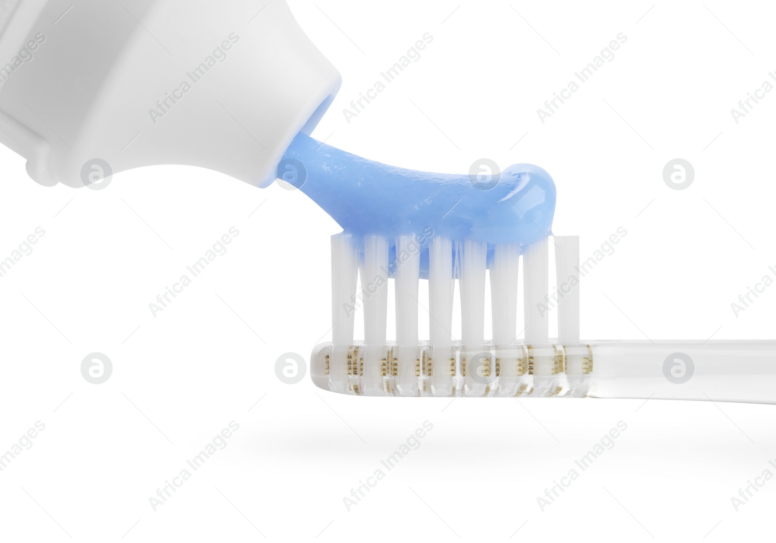 Photo of Squeezing toothpaste onto electric toothbrush isolated on white, closeup