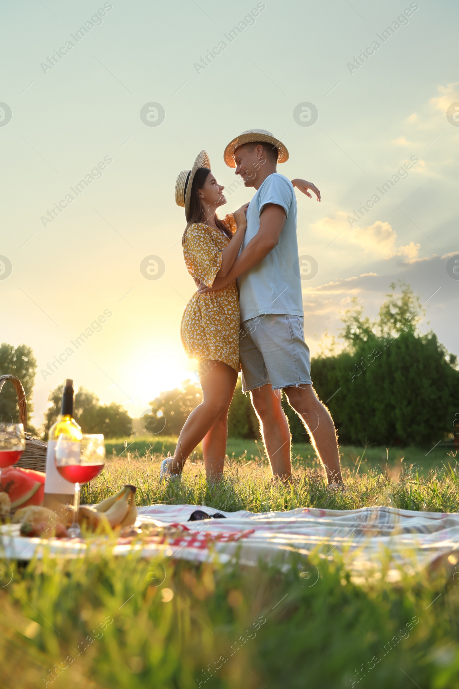 Photo of Happy couple hugging on picnic in park