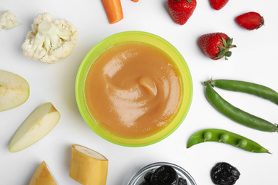 Photo of Flat lay composition with baby food and ingredients on white background