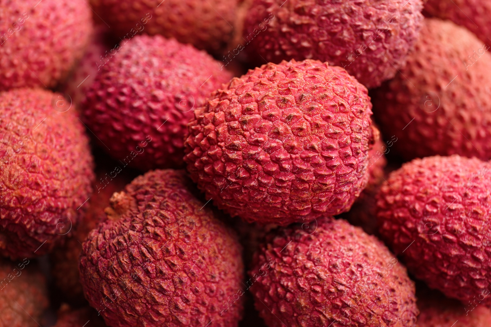 Photo of Pile of fresh ripe lychees as background, closeup