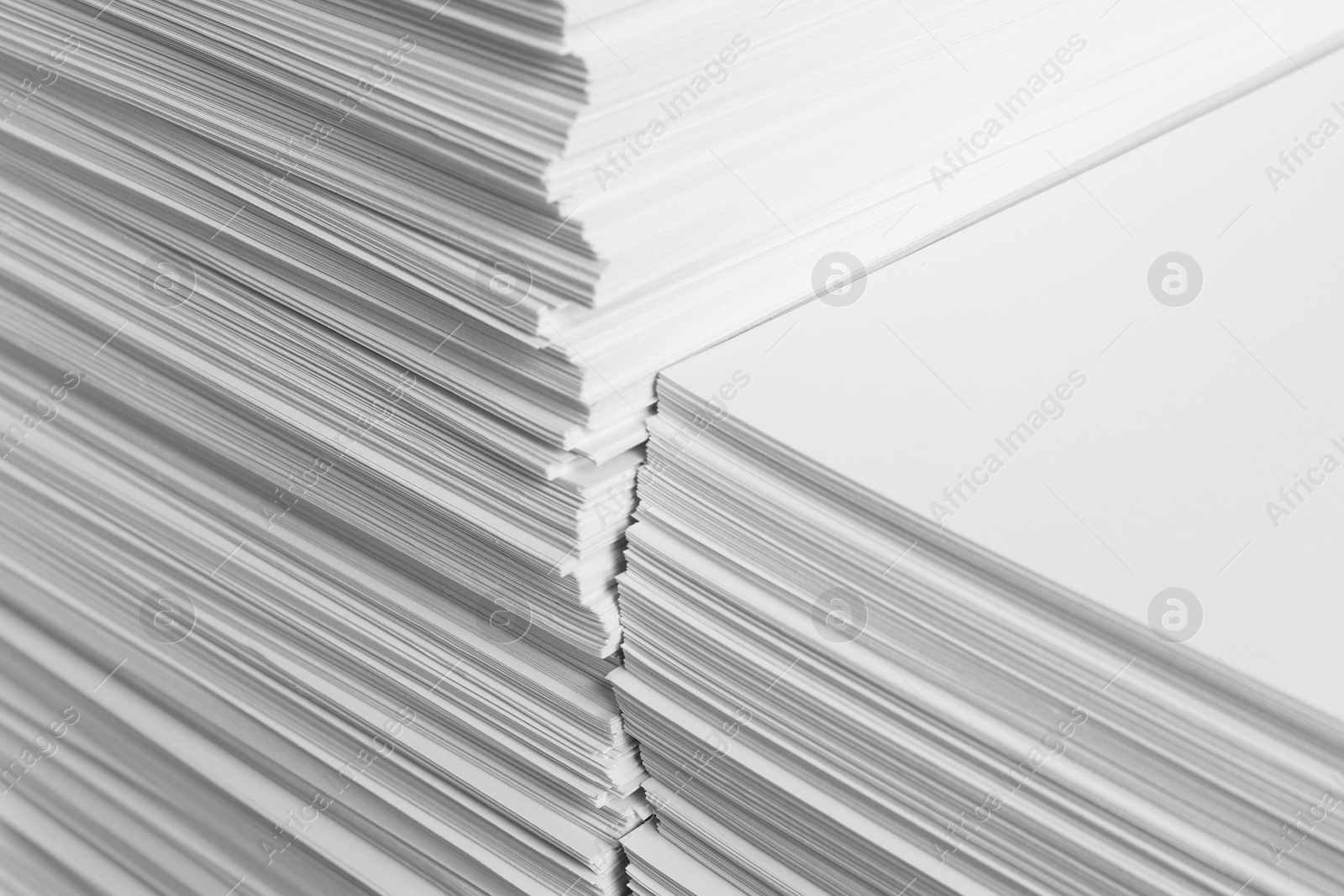 Photo of Stacks of white paper sheets, closeup view