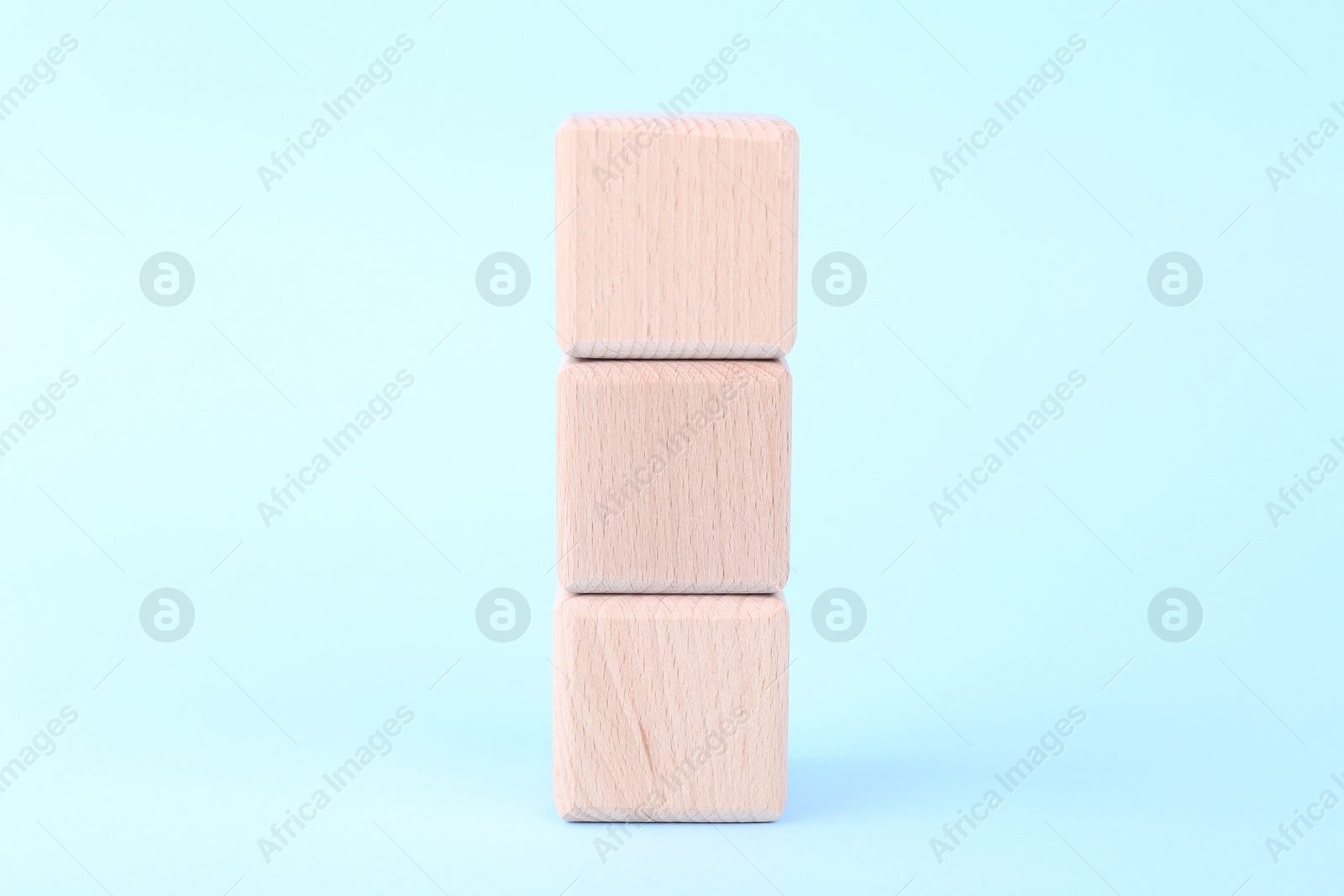 Photo of International Organization for Standardization. Wooden cubes with abbreviation ISO on light blue background