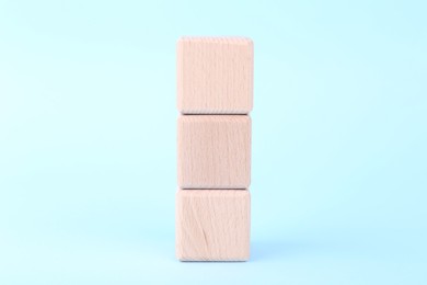 International Organization for Standardization. Wooden cubes with abbreviation ISO on light blue background