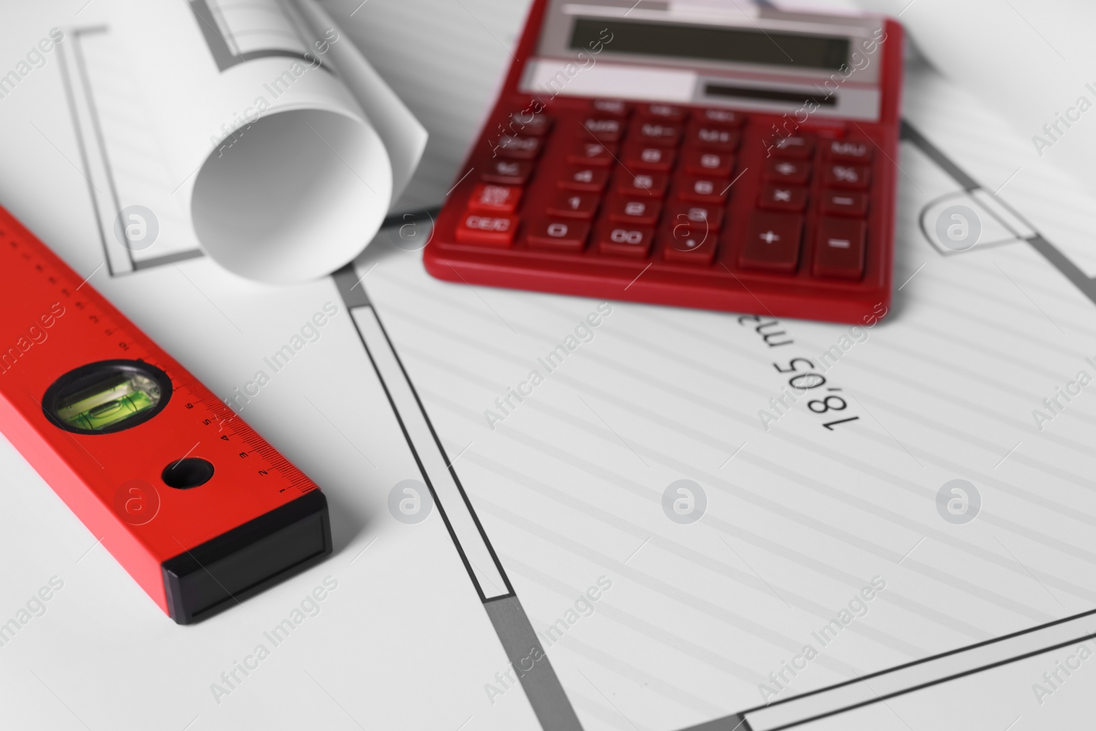 Photo of Construction drawings, calculator and ruler, closeup view