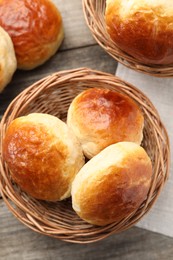 Photo of Freshly baked soda water scones on wooden table, flat lay