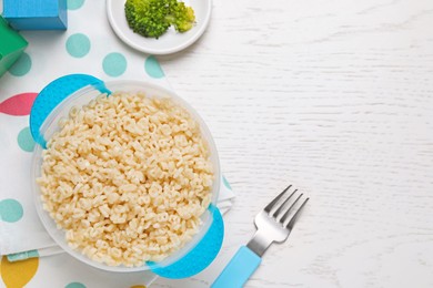 Tasty pasta served on white wooden table, flat lay. Space for text