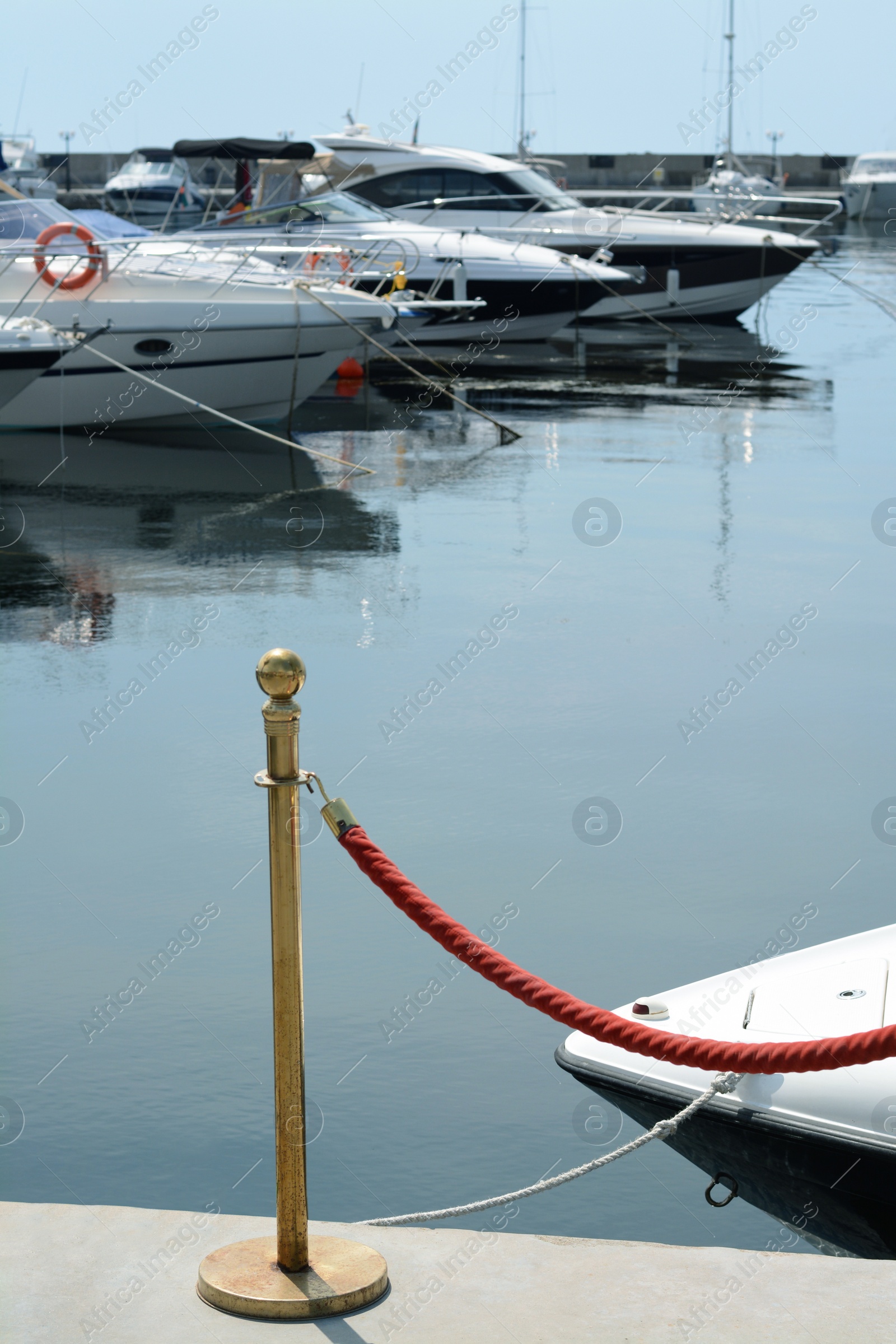 Photo of Beautiful view of city pier with moored boats on sunny day