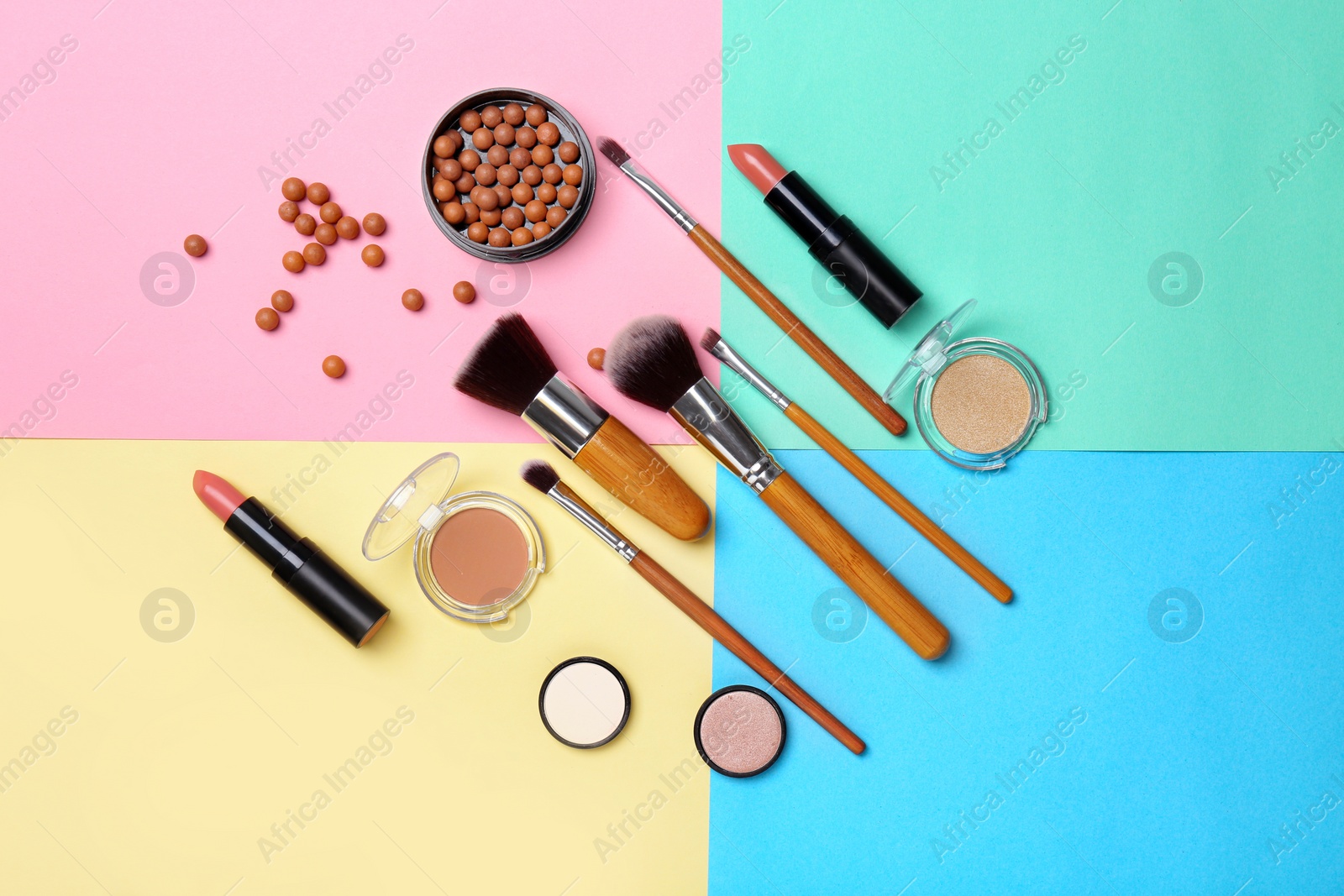 Photo of Decorative makeup products on color background