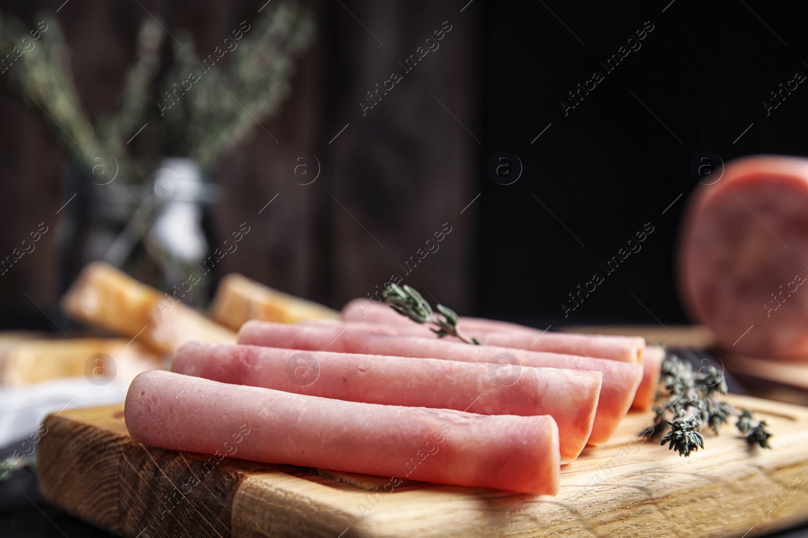 Photo of Slices of tasty ham on table, closeup