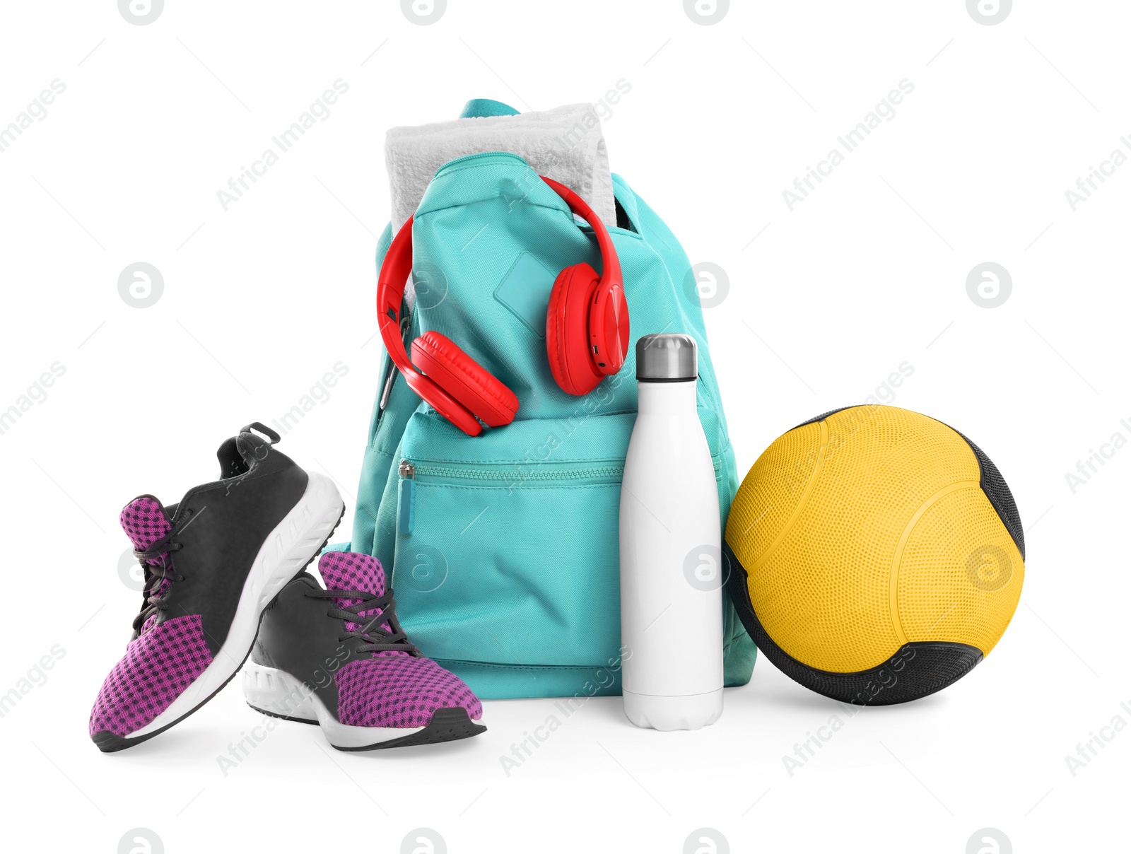 Photo of Backpack with sports equipment on white background