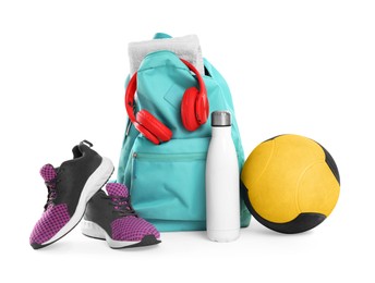 Photo of Backpack with sports equipment on white background