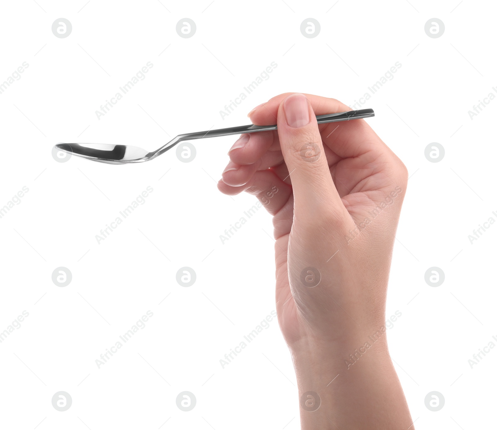 Photo of Woman holding new shiny spoon on white background, closeup