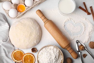 Flat lay composition with dough and flour on white table