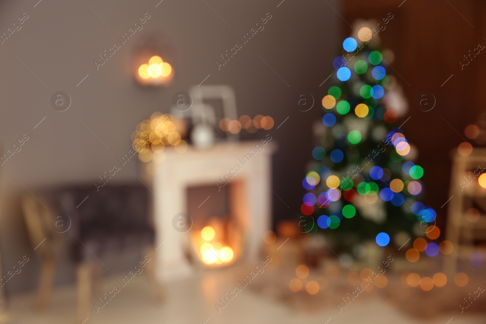 Photo of Blurred stylish room interior with Christmas tree and decorative fireplace