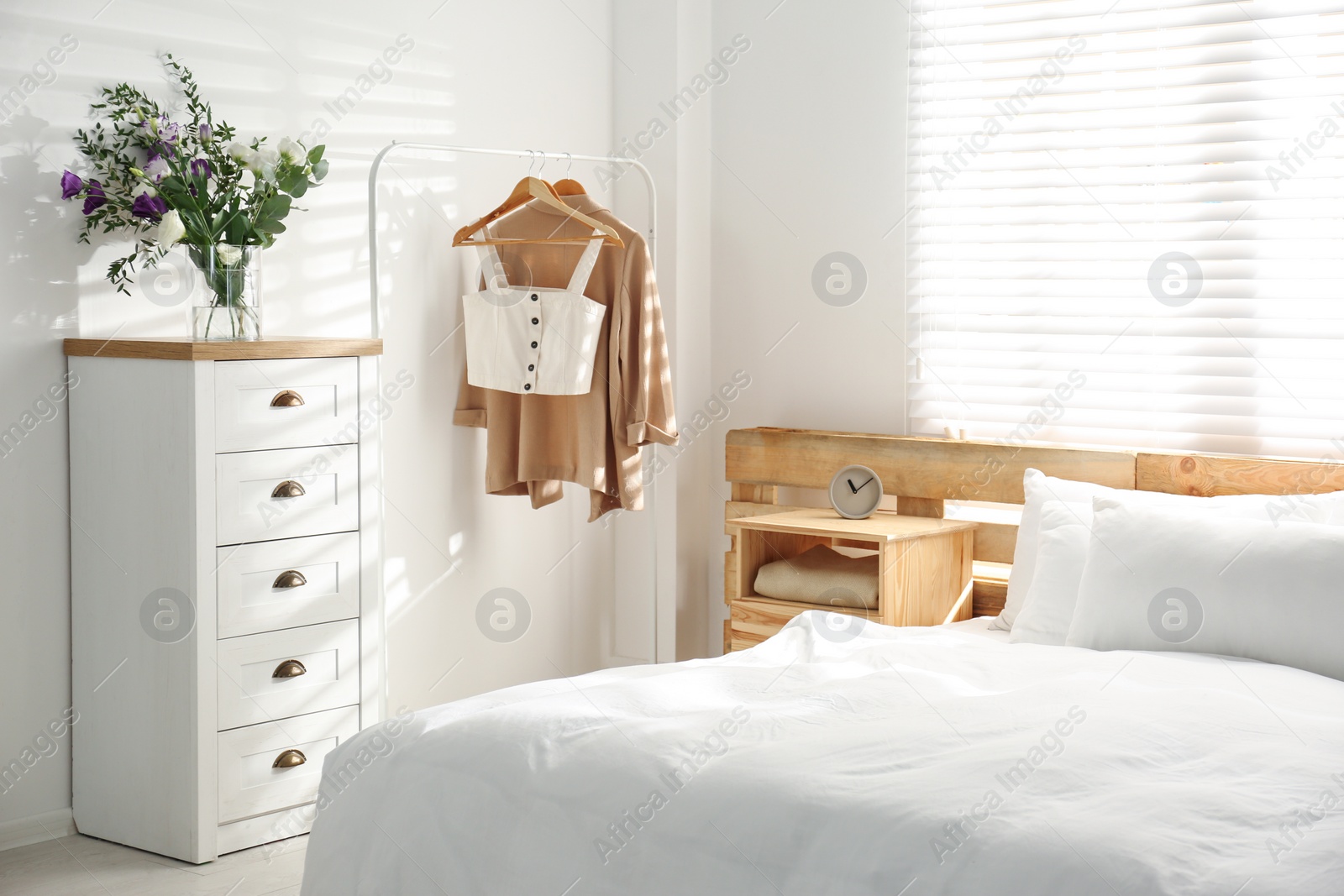 Photo of Stylish bedroom with modern chest of drawers