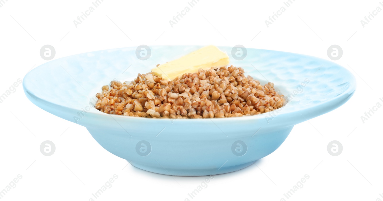 Photo of Plate of buckwheat porridge with butter isolated on white