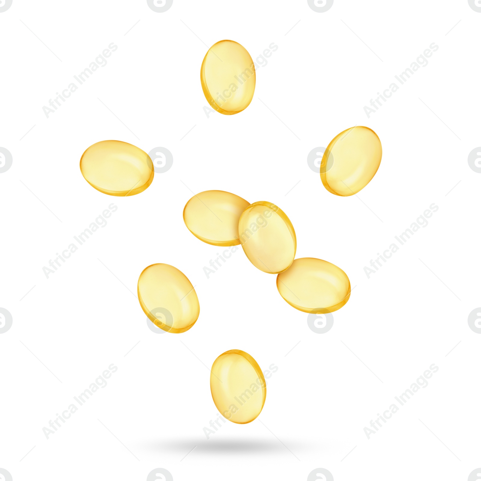 Image of Vitamin. Softgel capsules falling on white background