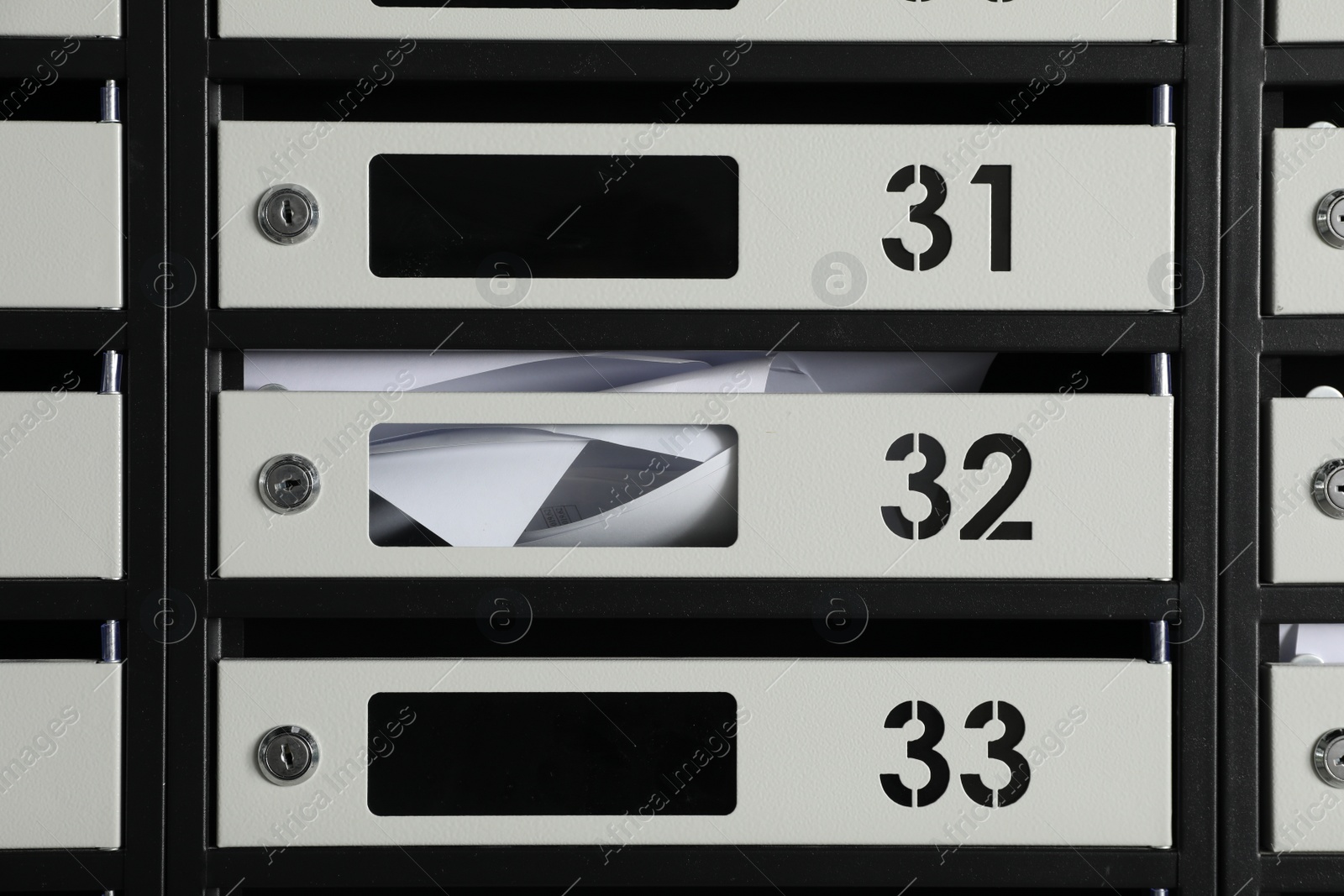 Photo of New mailboxes with keyholes, numbers and receipts as background