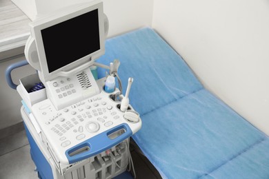 Photo of Ultrasound machine and examination table in hospital, above view