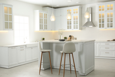 Photo of Beautiful kitchen interior with new stylish furniture