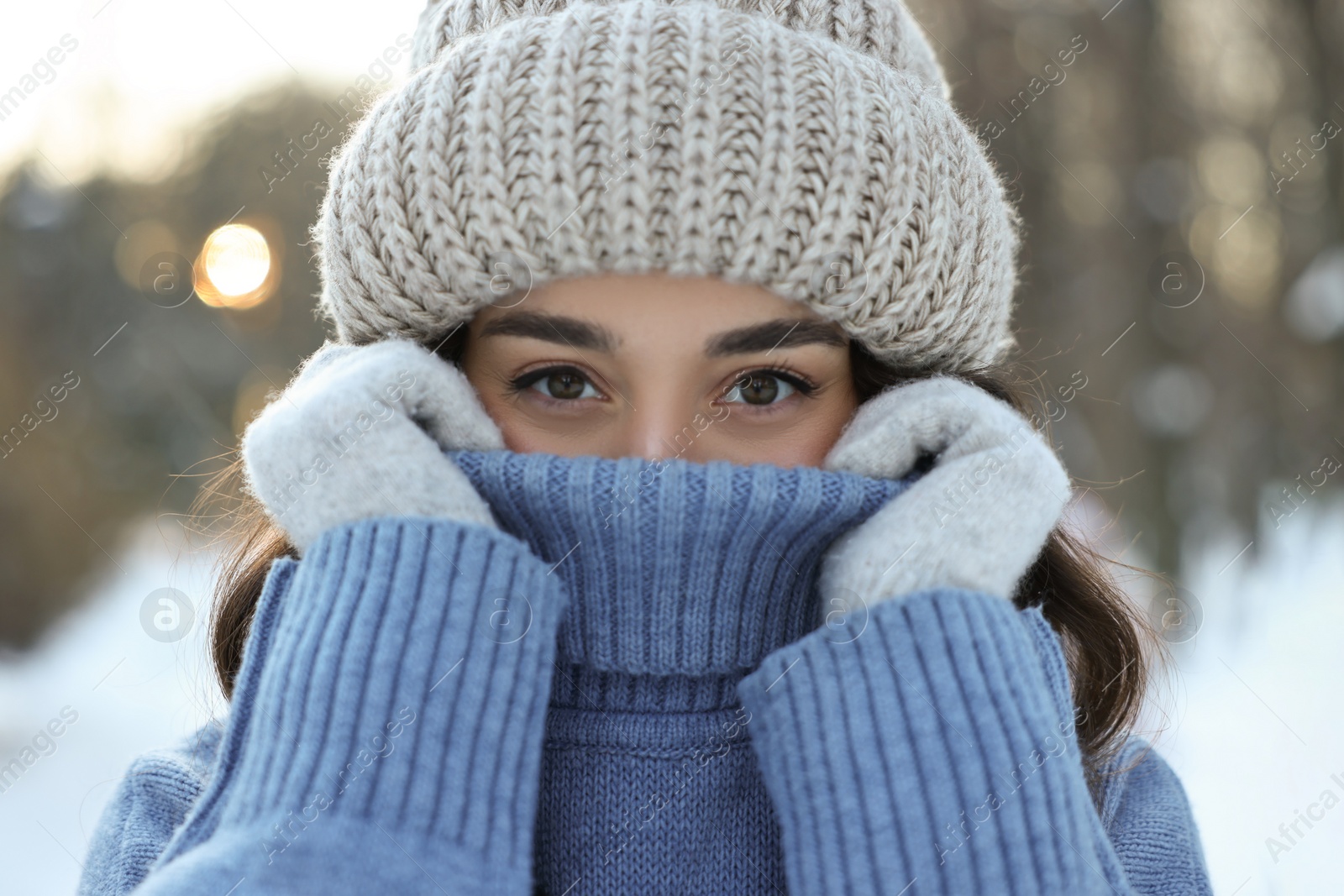 Photo of Portrait of young woman in snowy park