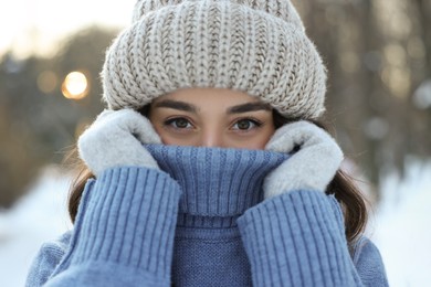 Photo of Portrait of young woman in snowy park