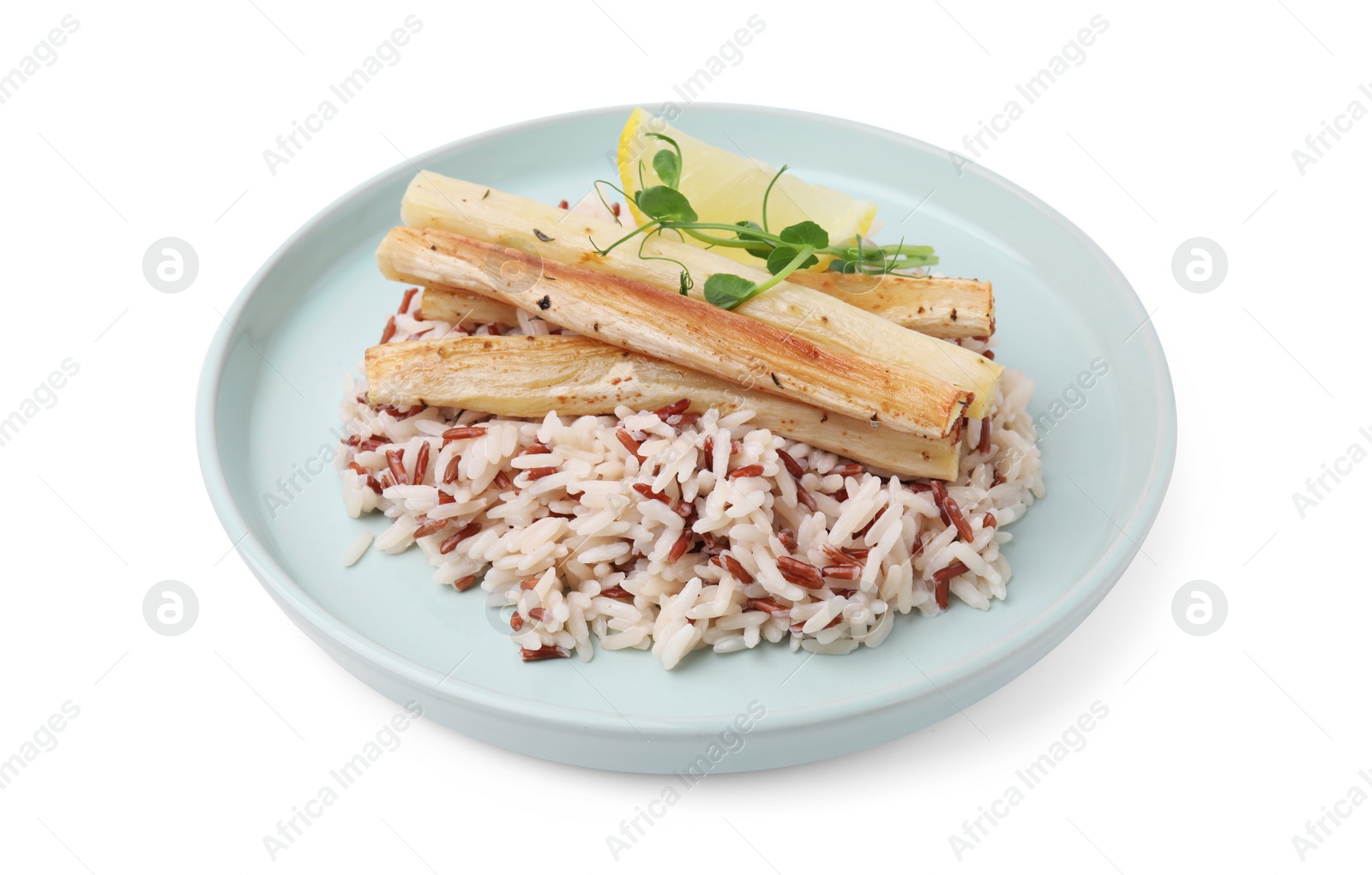 Photo of Plate with baked salsify roots, lemon and rice isolated on white