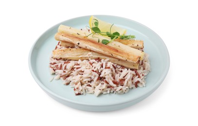 Photo of Plate with baked salsify roots, lemon and rice isolated on white