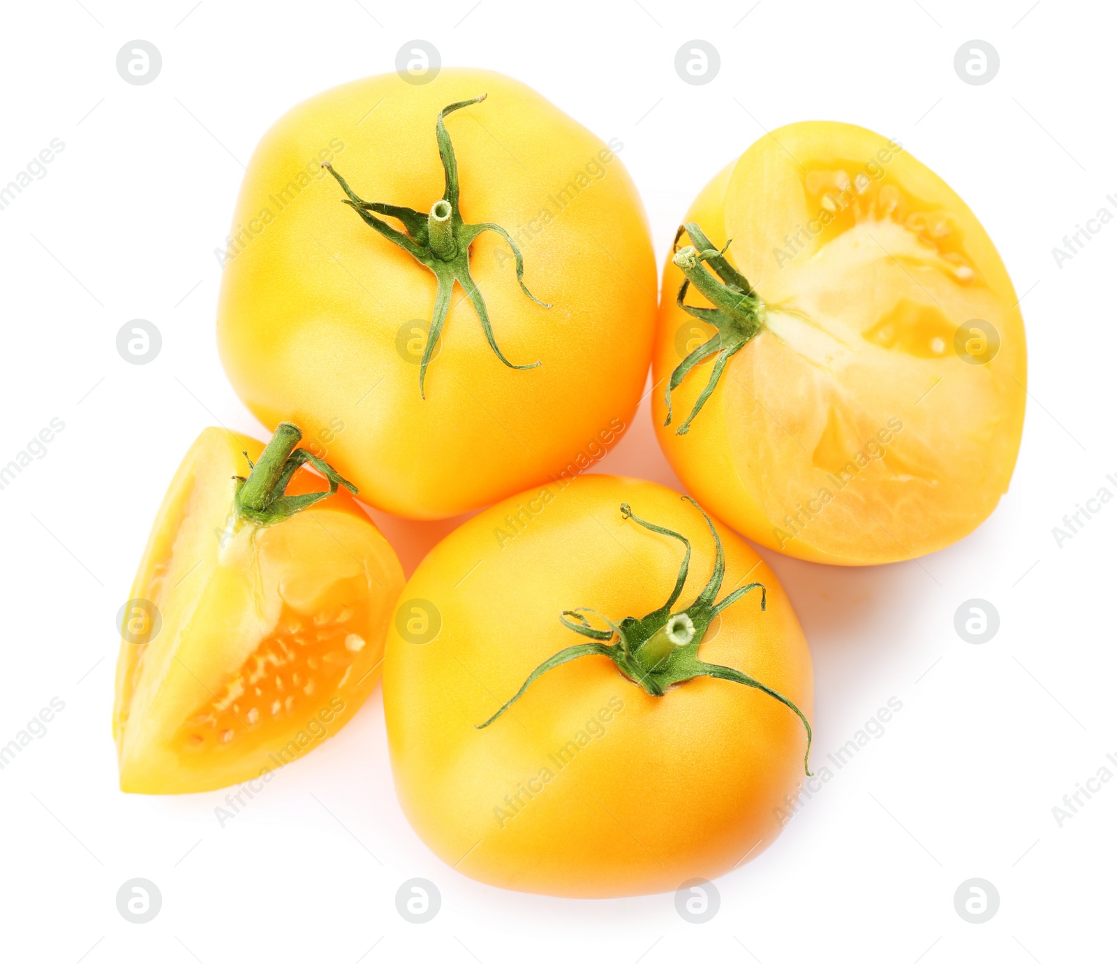 Photo of Cut ripe yellow tomatoes isolated on white, top view