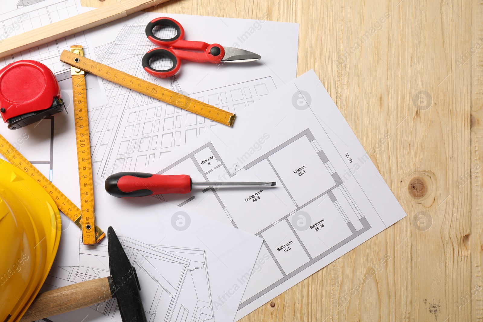 Photo of Flat lay composition with different construction tools on wooden background