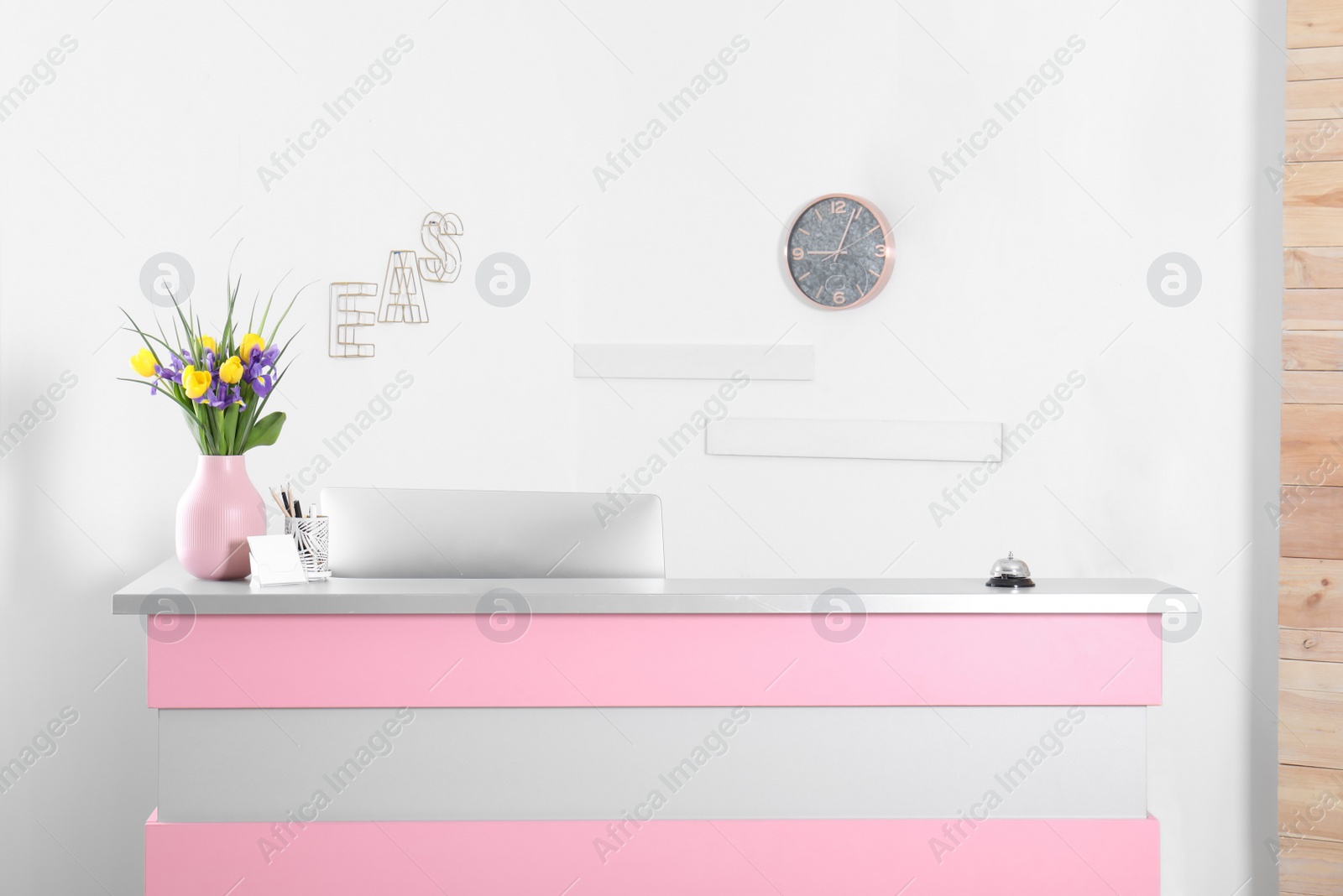 Photo of Modern reception desk in beauty salon. Stylish interior