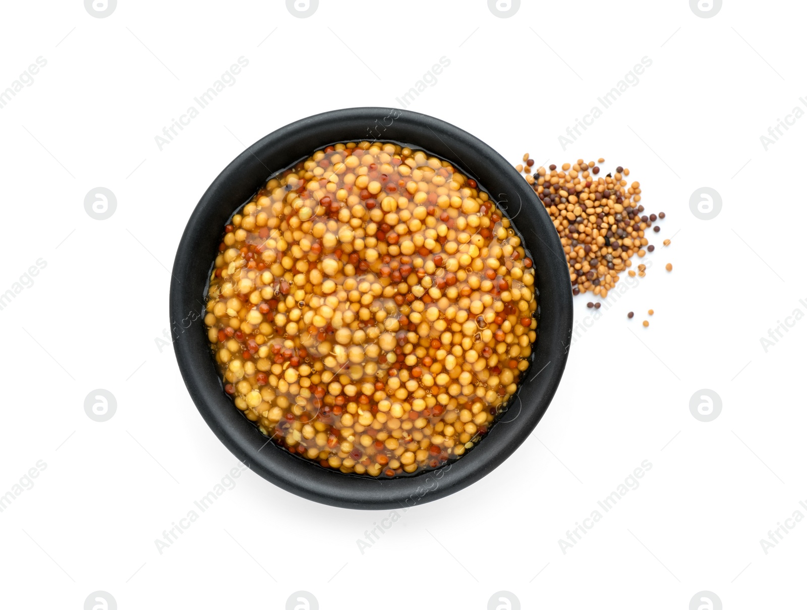 Photo of Fresh whole grain mustard in bowl and dry seeds isolated on white, top view