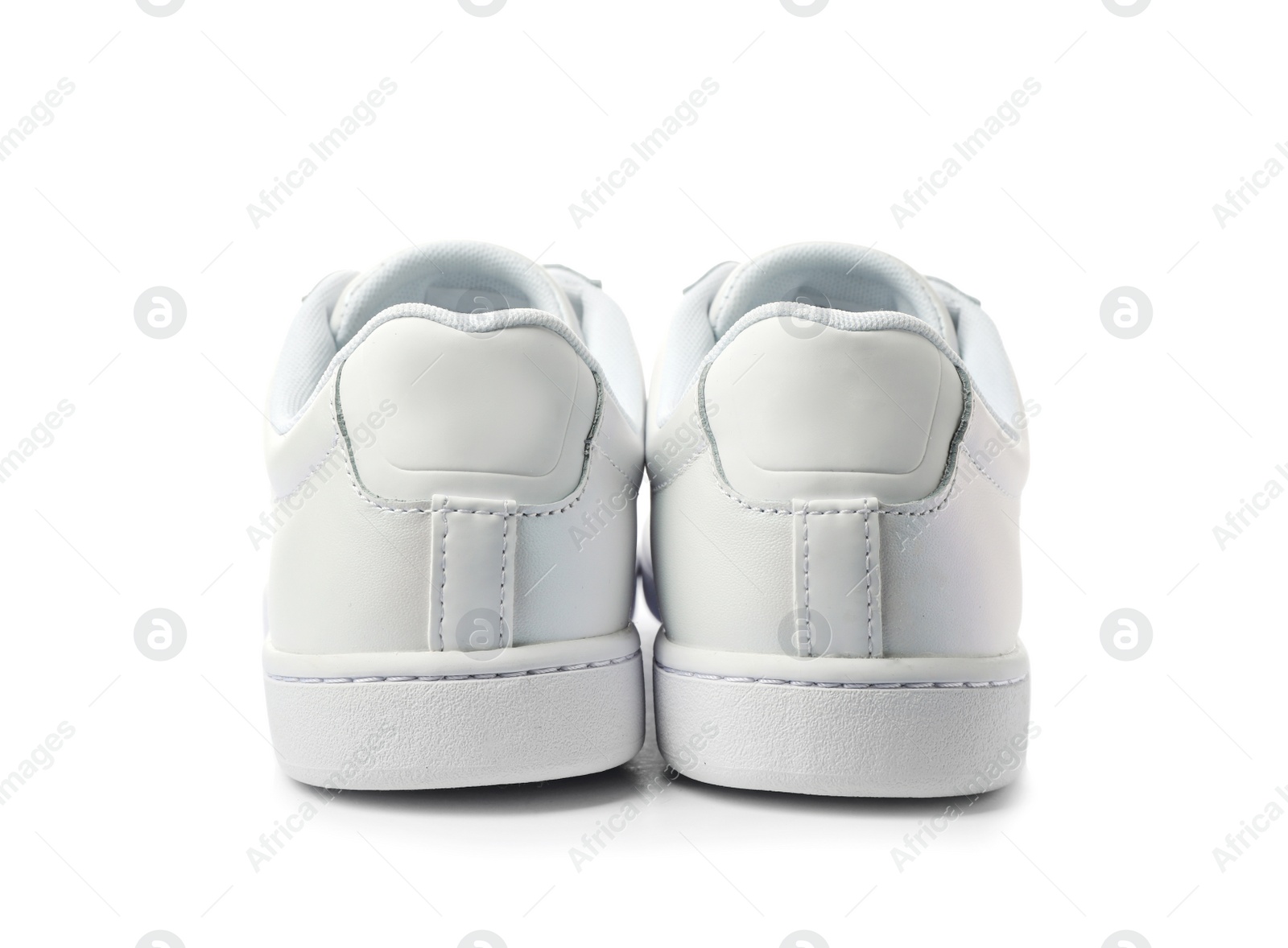 Photo of Pair of trendy sneakers on white background