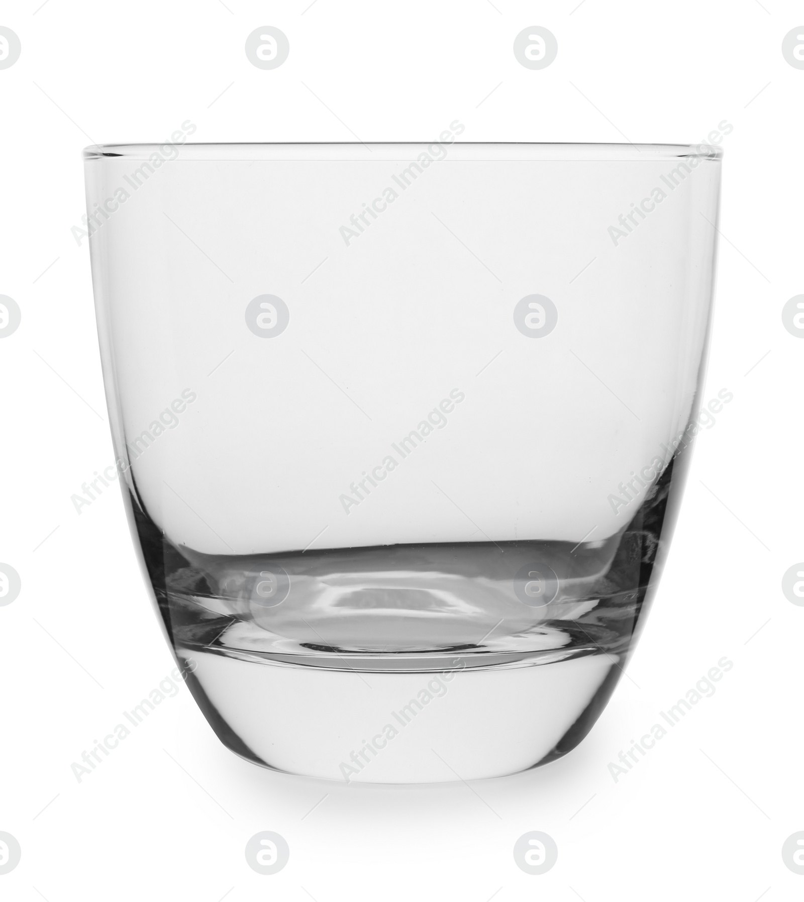 Photo of Clean empty whiskey glass isolated on white